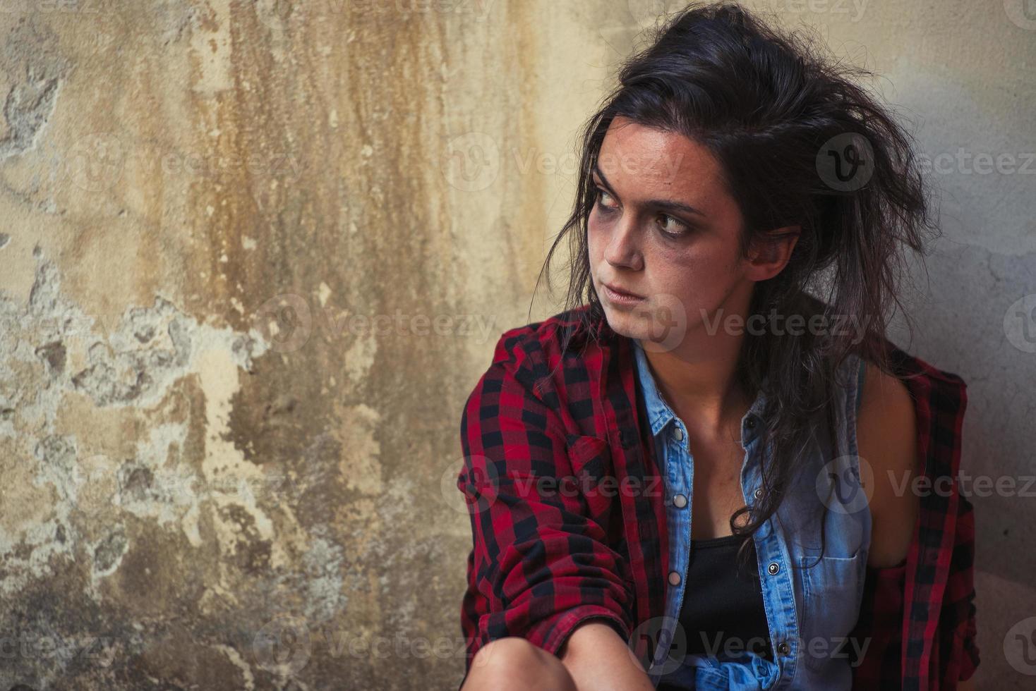 Young woman dependent on alcohol and drugs photo