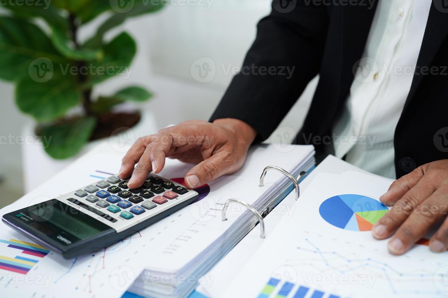 Business woman working and analysis with statistic graph in office. photo