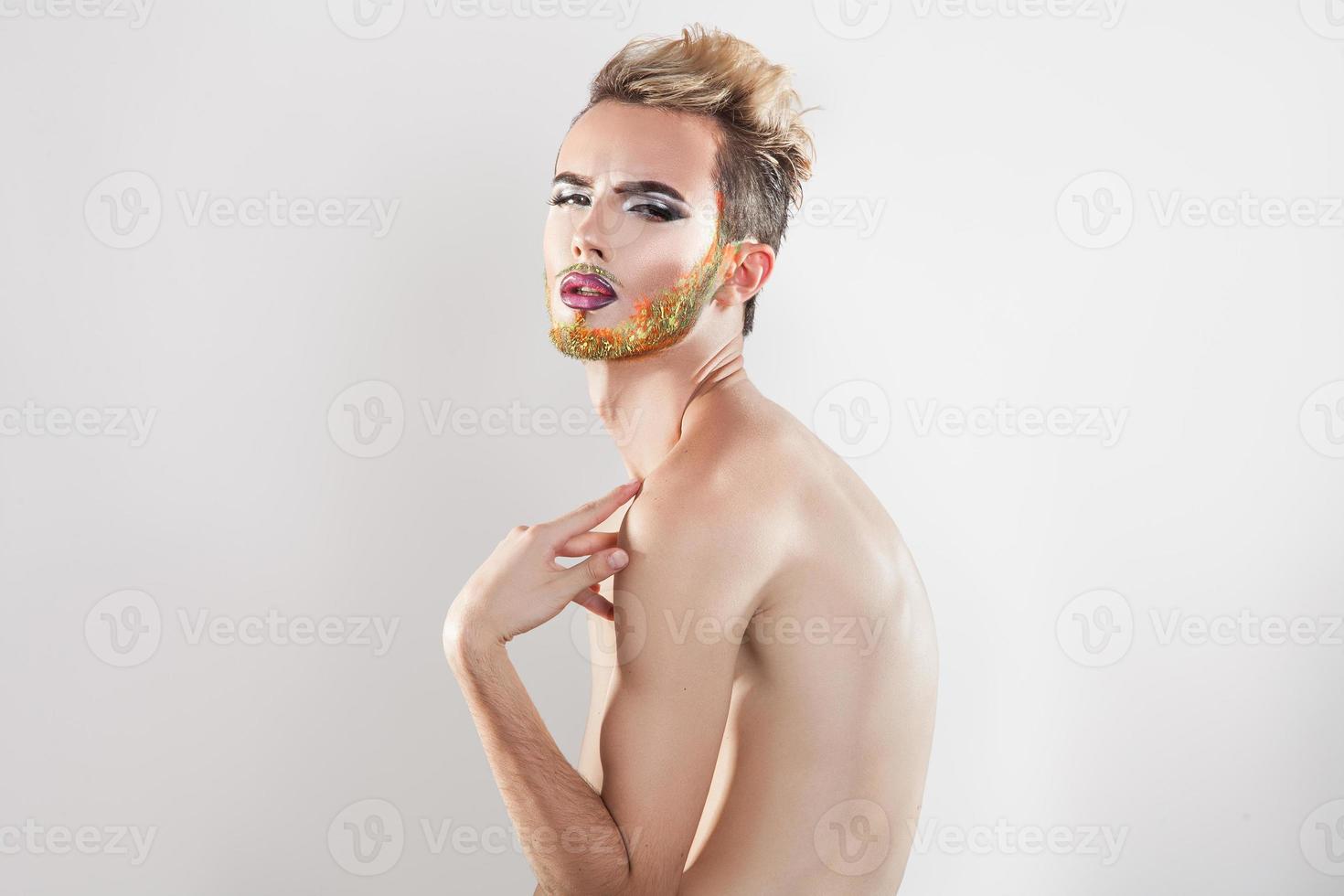 Horizotnal portrait of beautiful gay model with multicolor beard photo