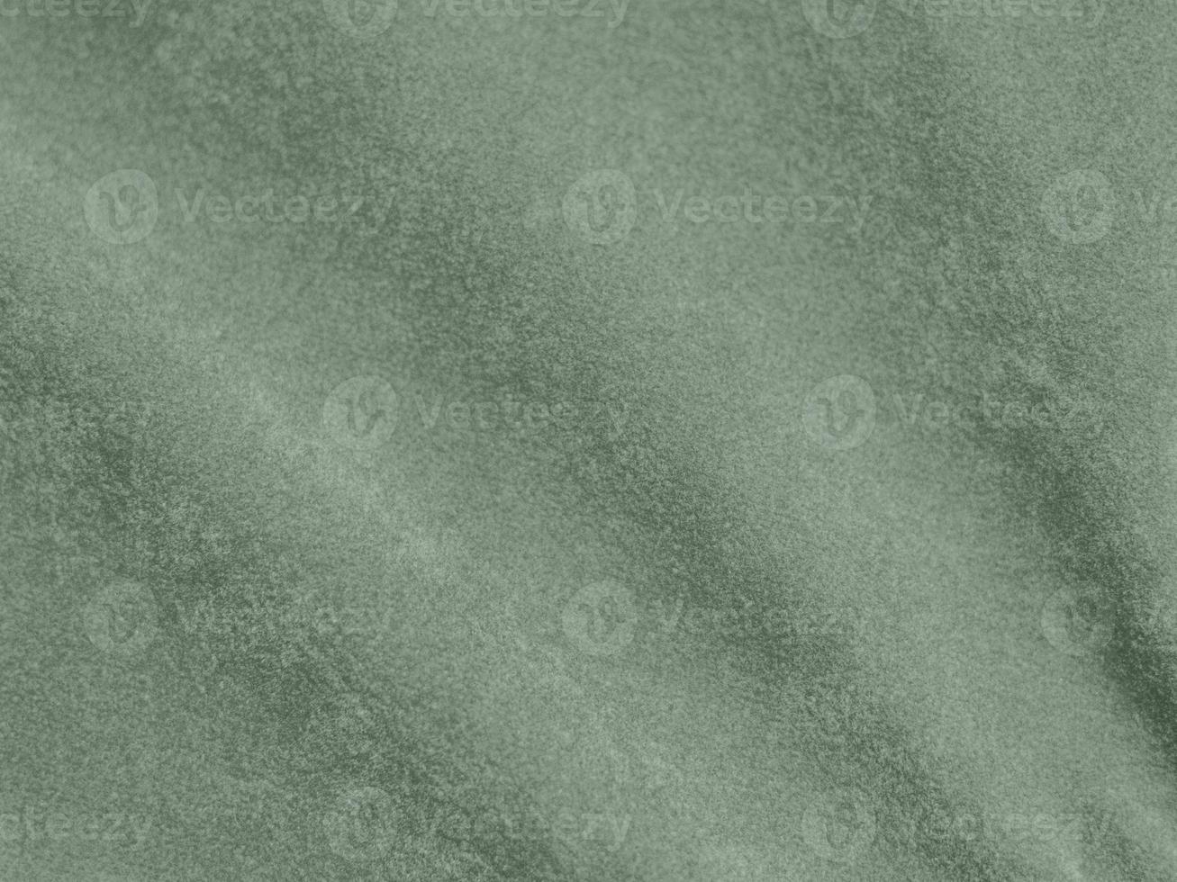 Olive green color velvet fabric texture used as background. light Olive green fabric background of soft and smooth textile material. There is space for text. photo