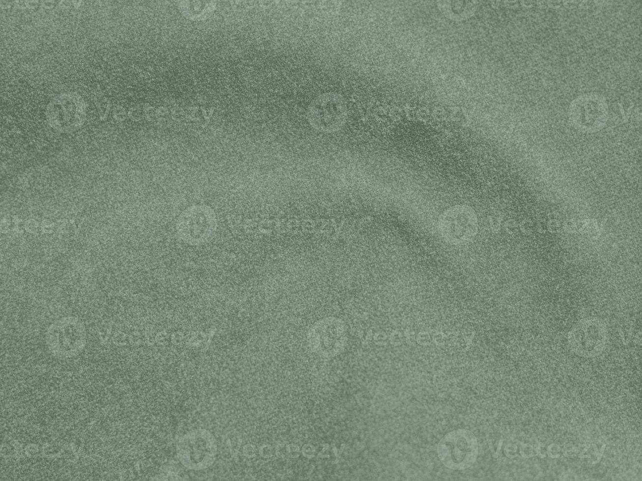 Olive green color velvet fabric texture used as background. light Olive green fabric background of soft and smooth textile material. There is space for text. photo