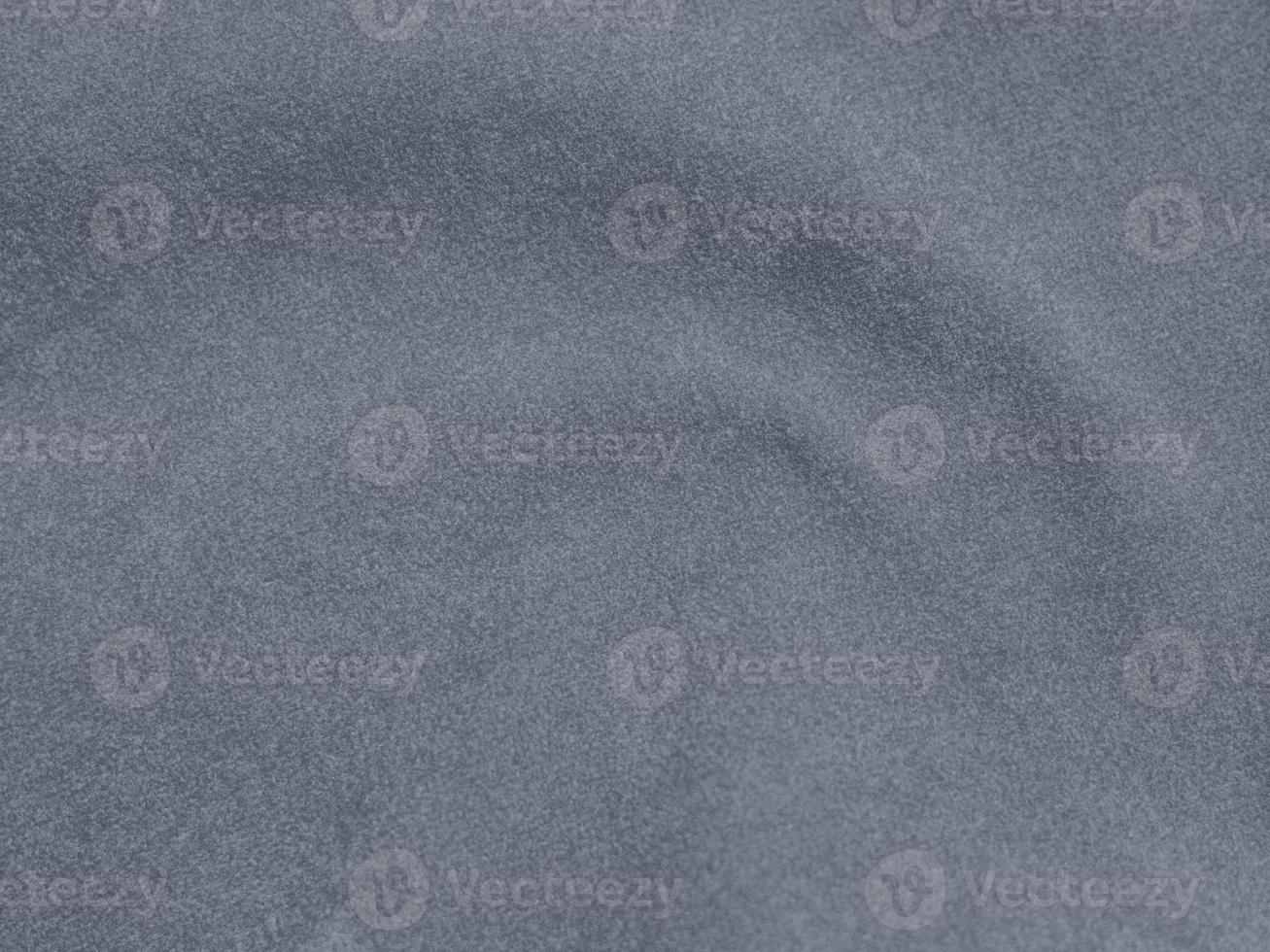 Greyish color velvet fabric texture used as background. blond color fabric background of soft and smooth Grey textile material ,Winter sea. There is space for text. photo