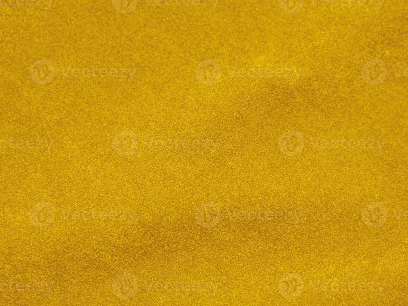 yellow velvet fabric texture used as background. Empty yellow  fabric background of soft and smooth textile material. There is space for text photo