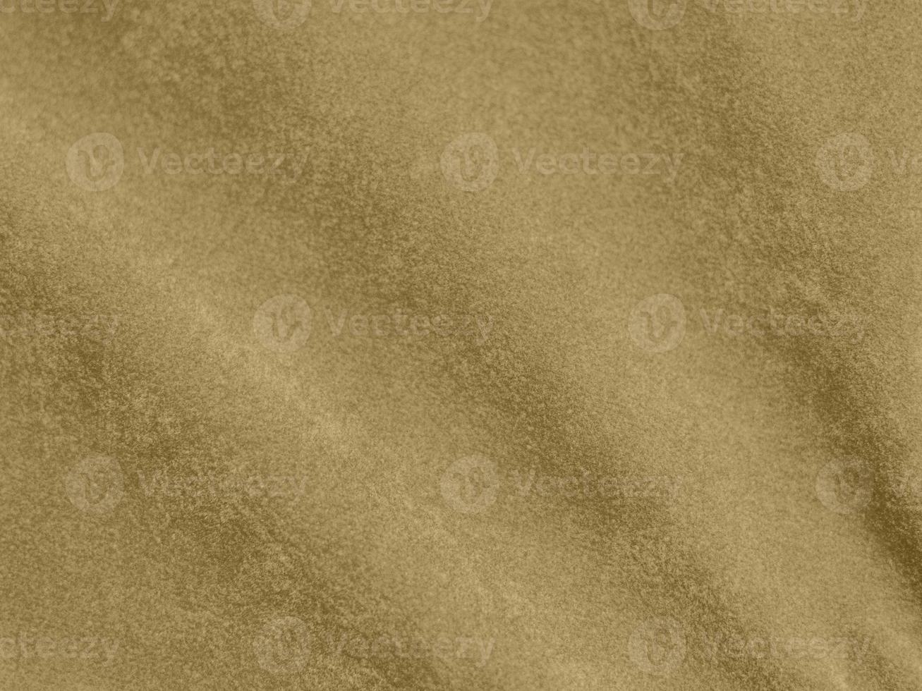 gold color velvet fabric texture used as background. blond color fabric background of soft and smooth textile material. There is space for text. photo