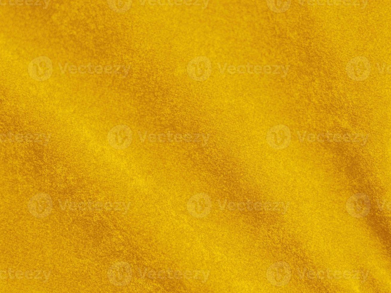 textura de tela de terciopelo amarillo utilizada como fondo. fondo de tela amarilla vacía de material textil suave y liso. hay espacio para el texto foto