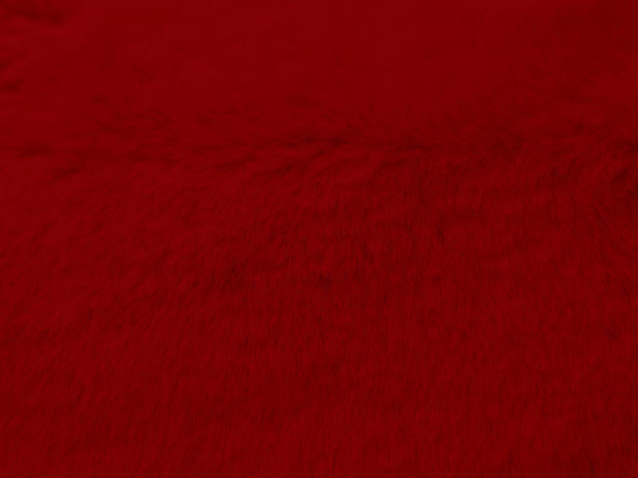 red clean wool texture background. light natural sheep wool.red seamless cotton. texture of fluffy fur for designers. close-up fragment white wool carpet.. photo