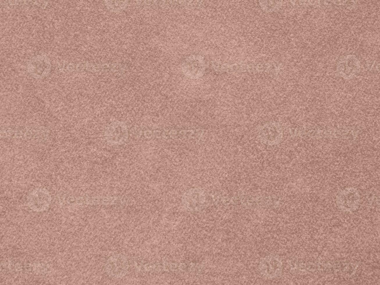 rose gold color velvet fabric texture used as background. Empty pink gold fabric background of soft and smooth textile material. There is space for text. photo