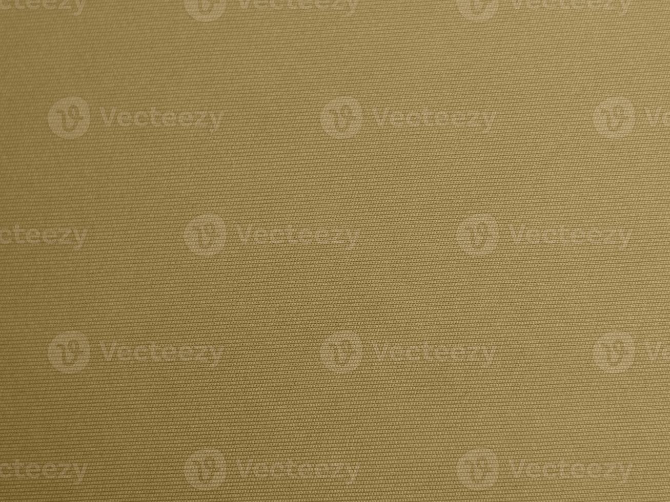 gold color velvet fabric texture used as background. blond color fabric background of soft and smooth textile material. There is space for text. photo