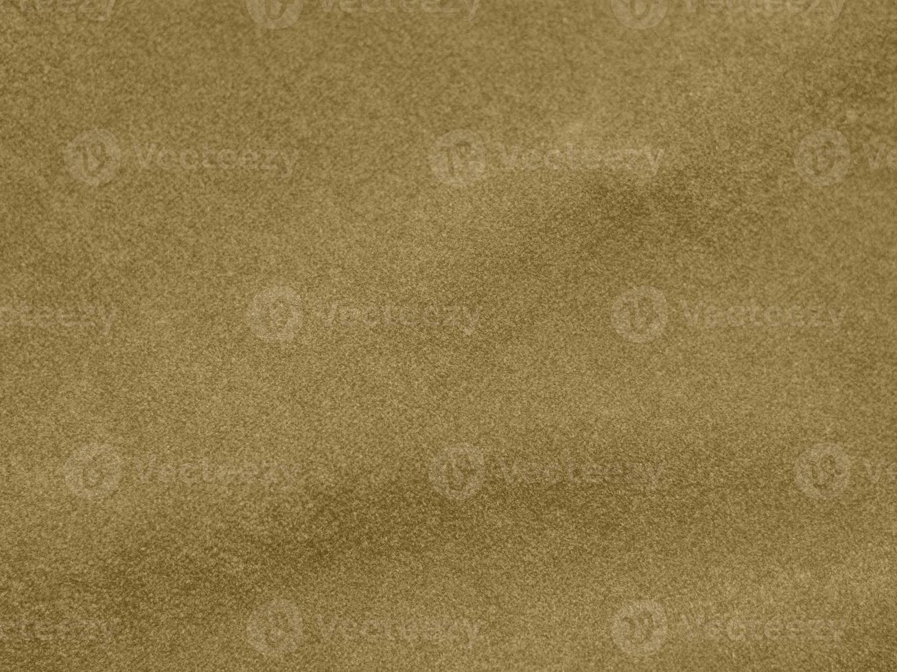 gold color velvet fabric texture used as background. blond color fabric background of soft and smooth textile material. There is space for text. photo