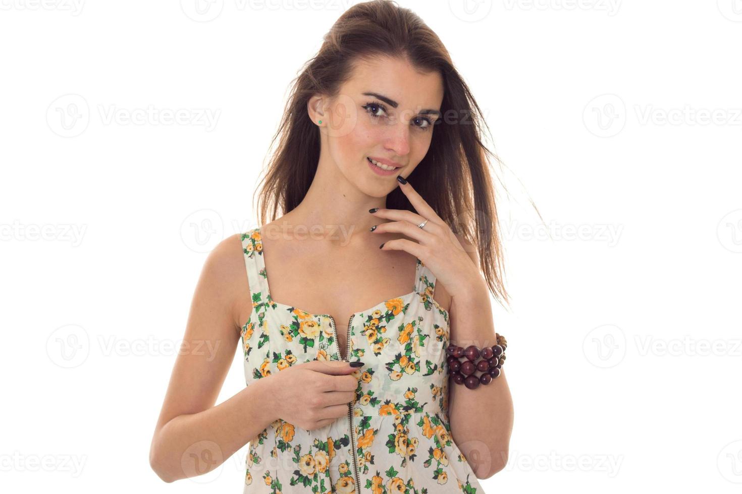 adorable young brunette woman take off her sarafan with floral pattern and seduce on camera isolated on white background photo