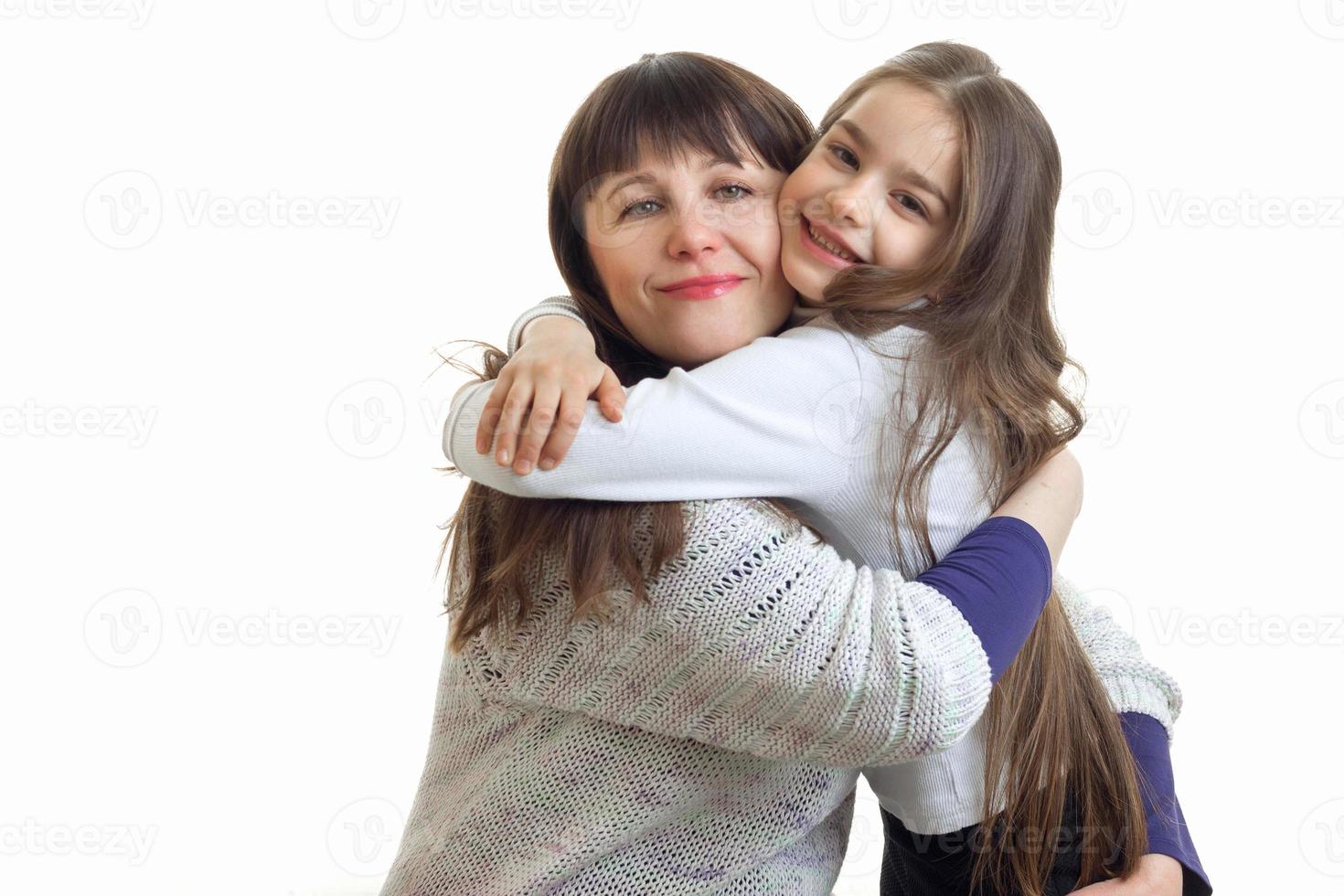 mother hugs her little daughter photo