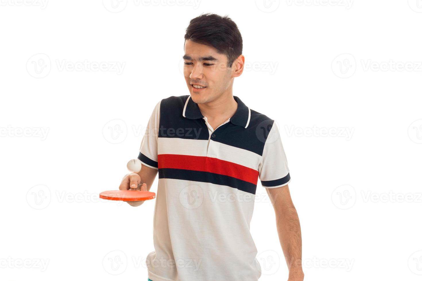 serious brunette sports man practicing ping-ping isolated on white background photo