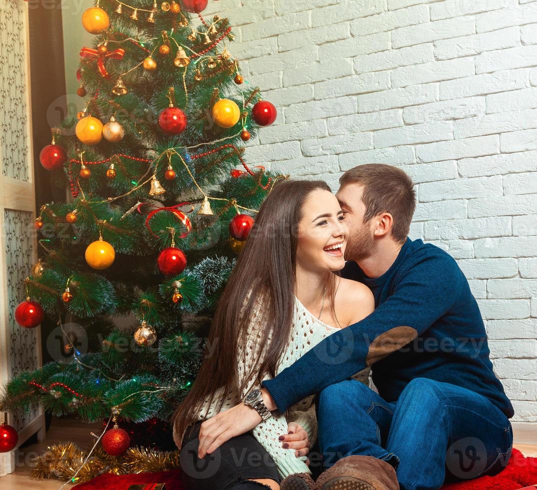 cheerful couple celebrates Christmas photo