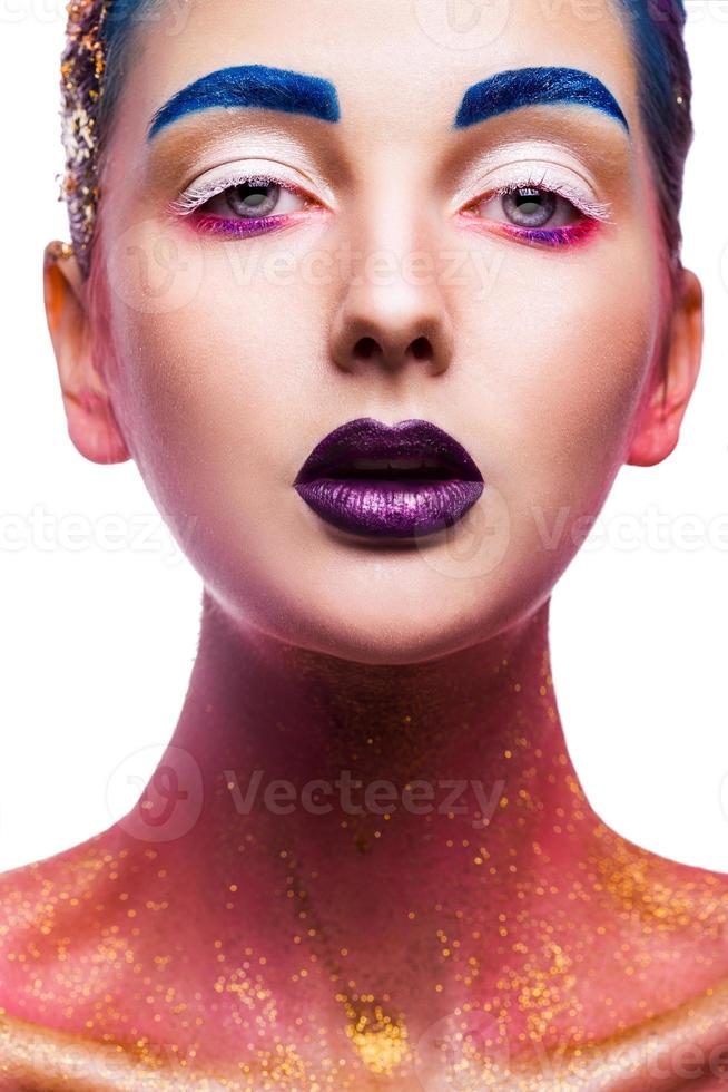 Beauty woman looking at camera with multicolor make up on white background photo