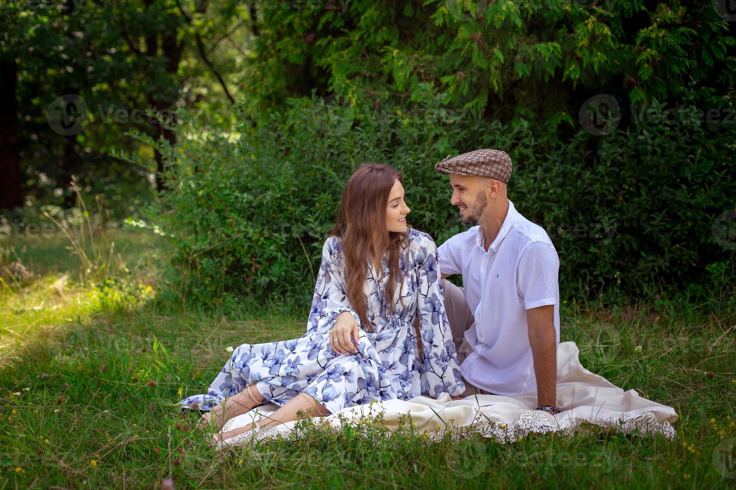 pretty couple in love at the picnic smiles each others photo