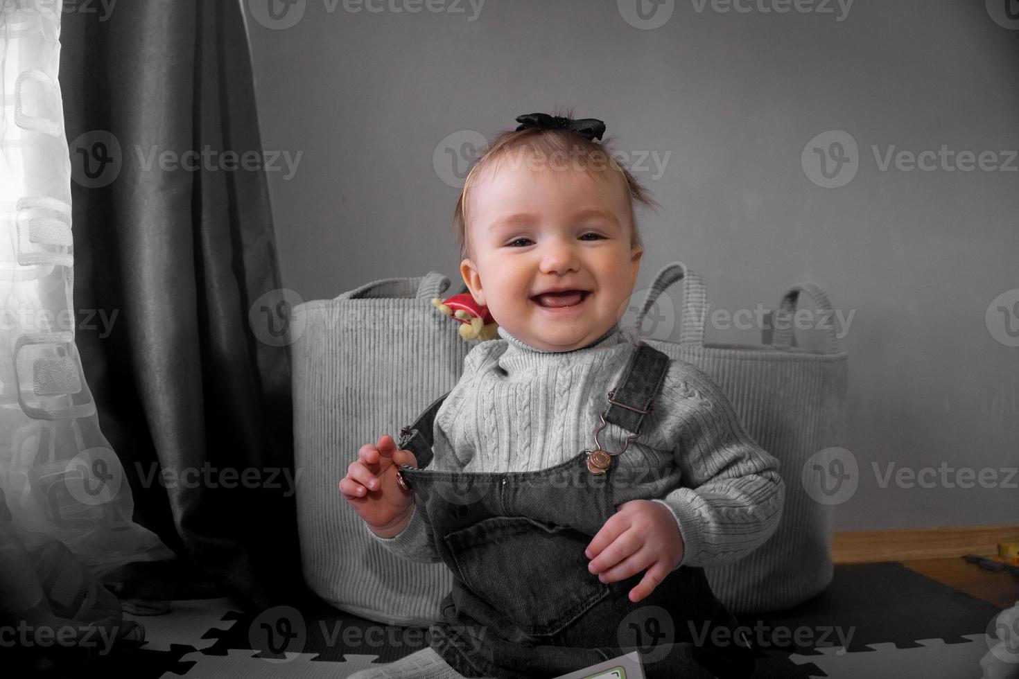 Cutie little baby girl smiles at home photo