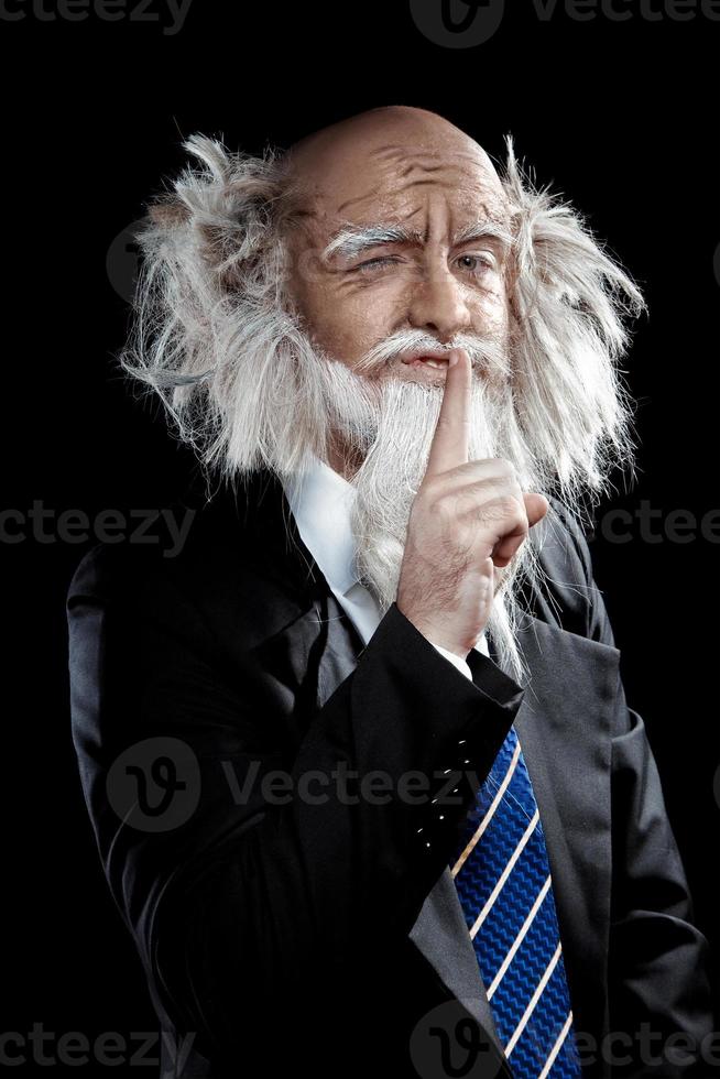 Grandfather in a stylish classic suit posing on black background photo