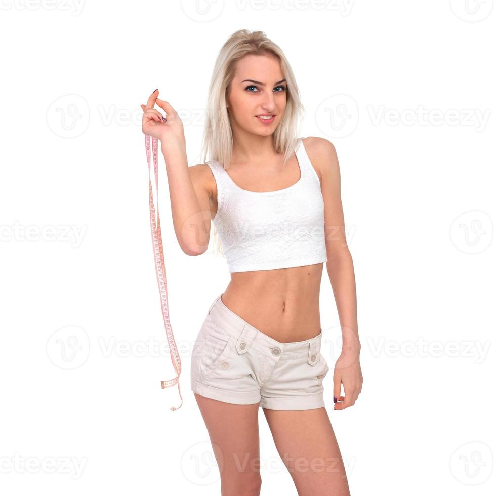 A slender woman with a measuring tape photo