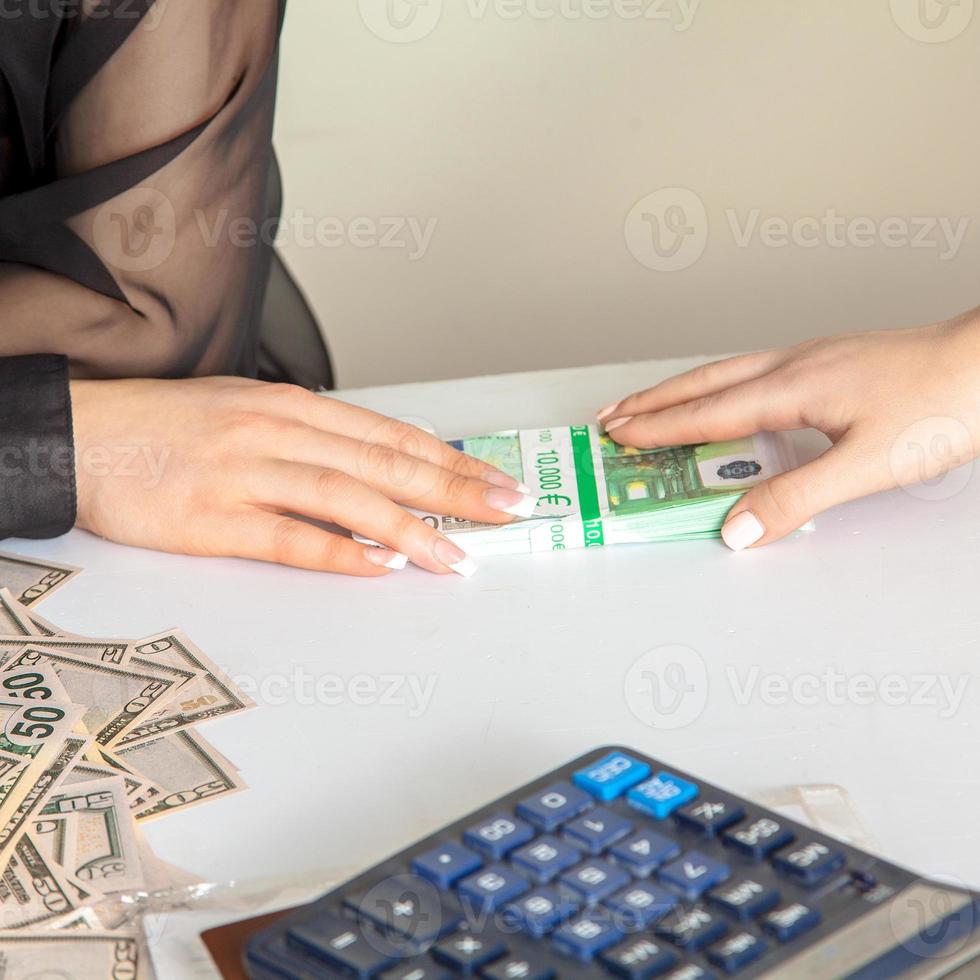 photo of transfer of a bribe from a stack of money
