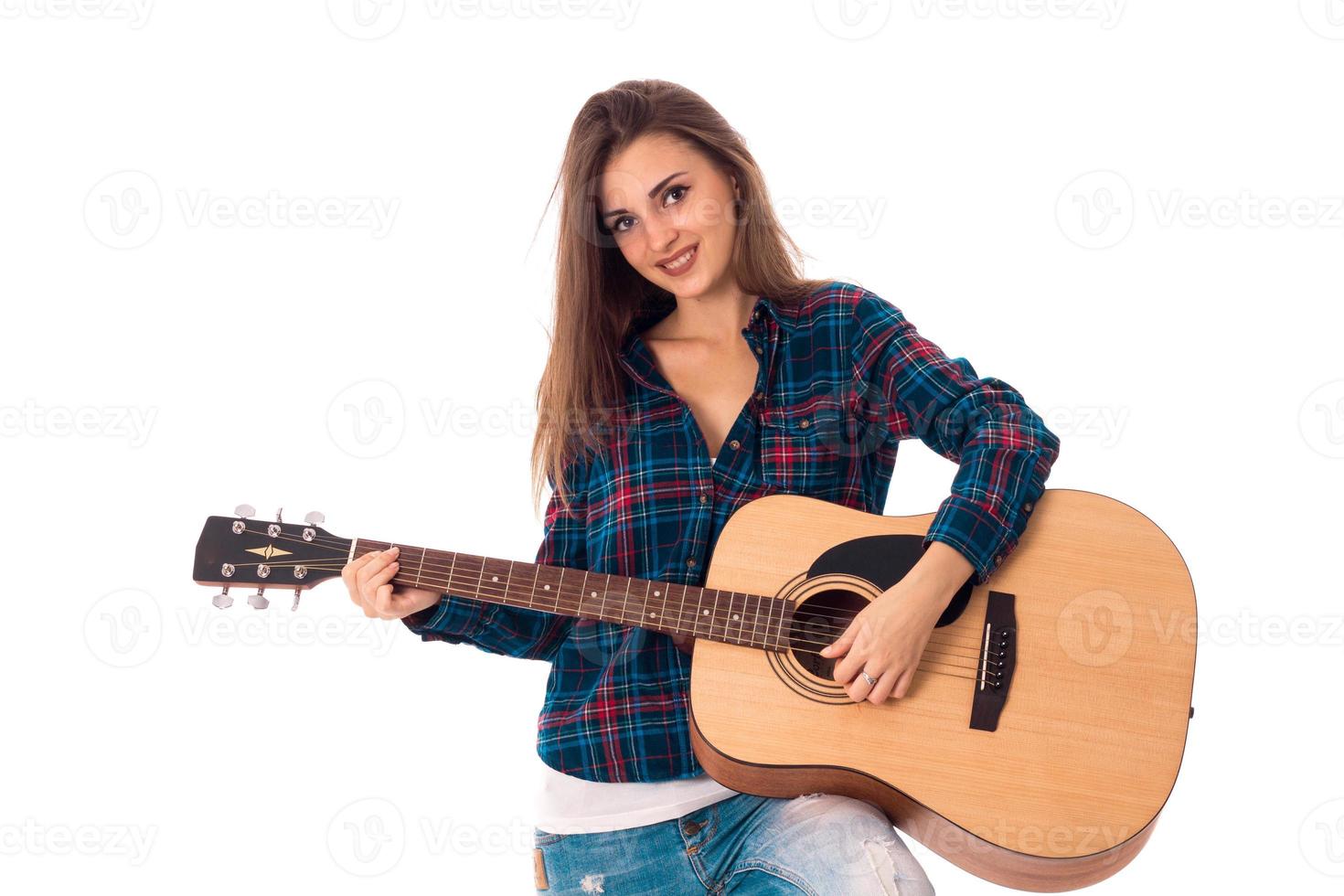 glamour brunette girl playing guitar photo