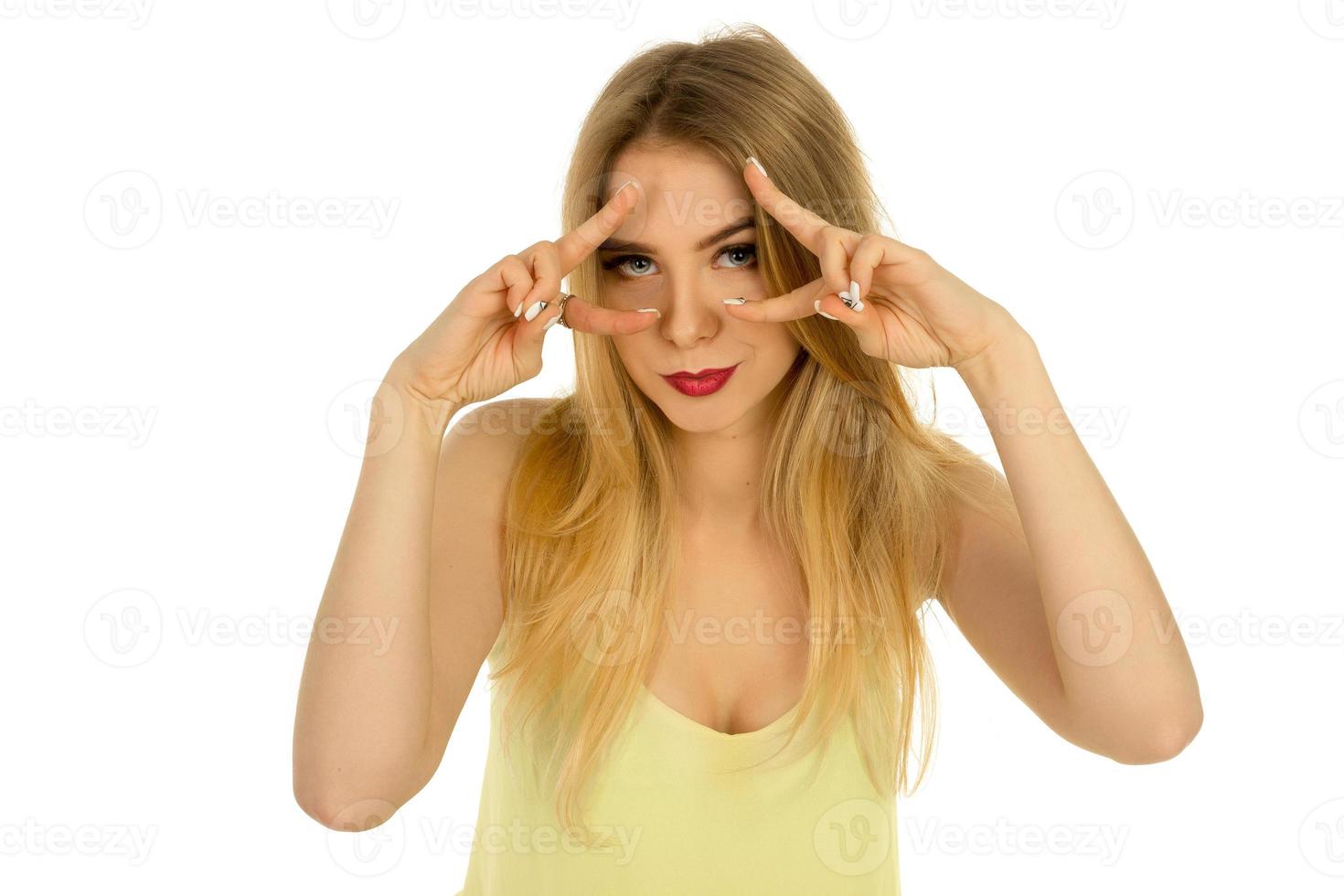 girl in yellow t-shirt posing in studio photo