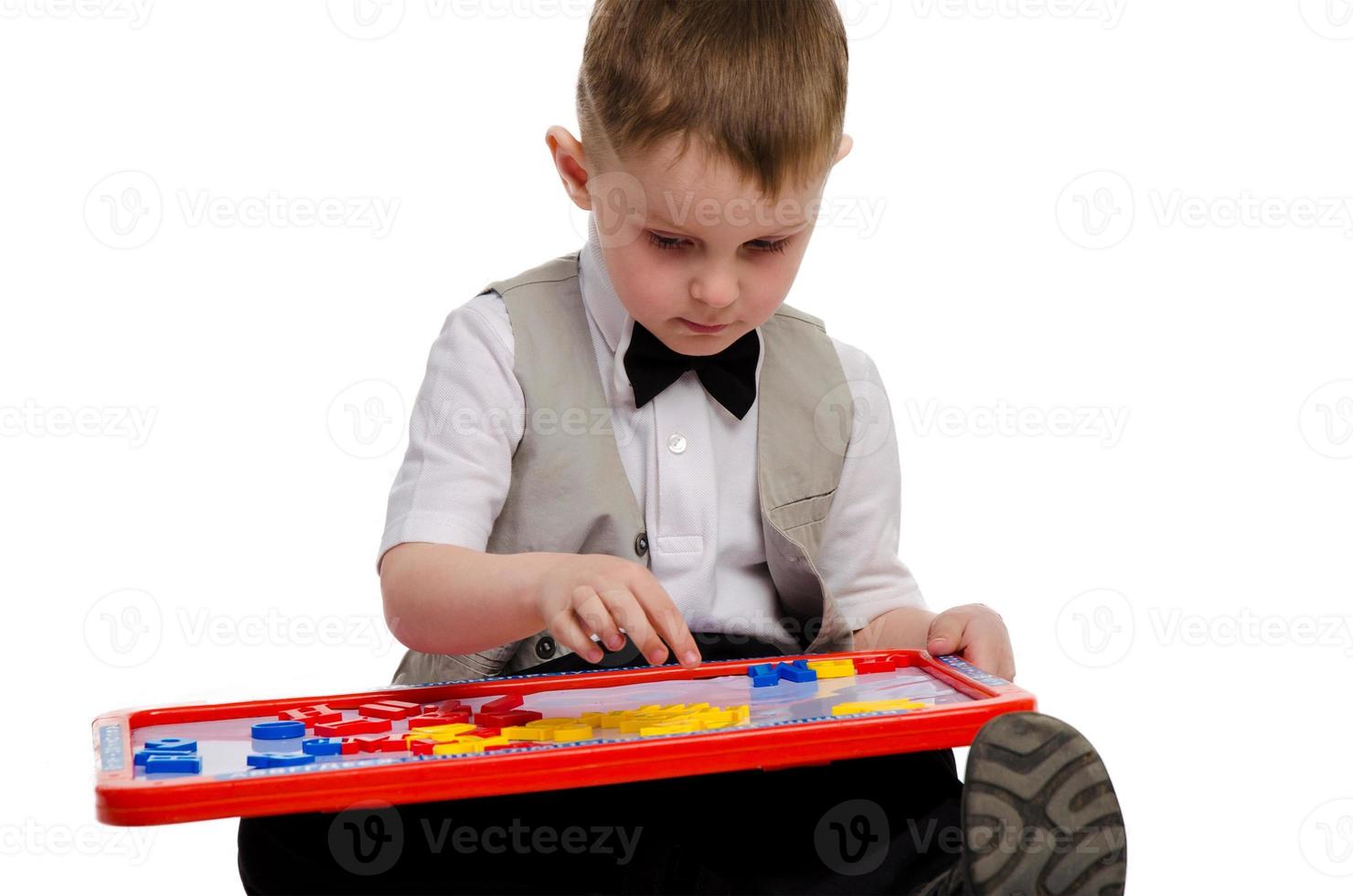 little elegant schoolboy in studio photo