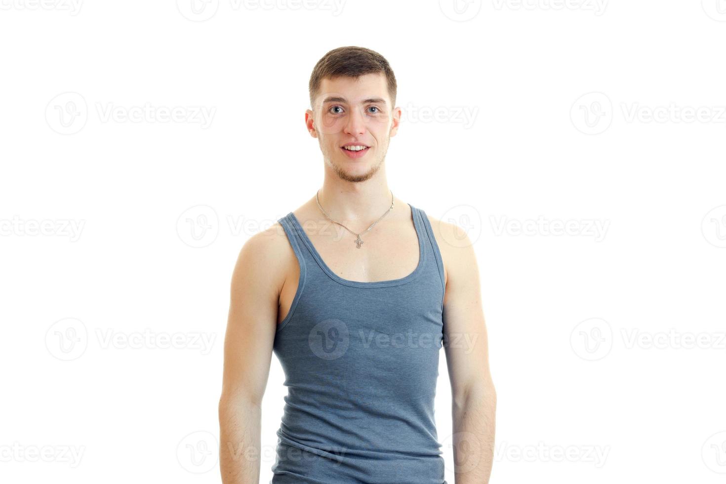 young guy in the gray shirt posing on camera photo