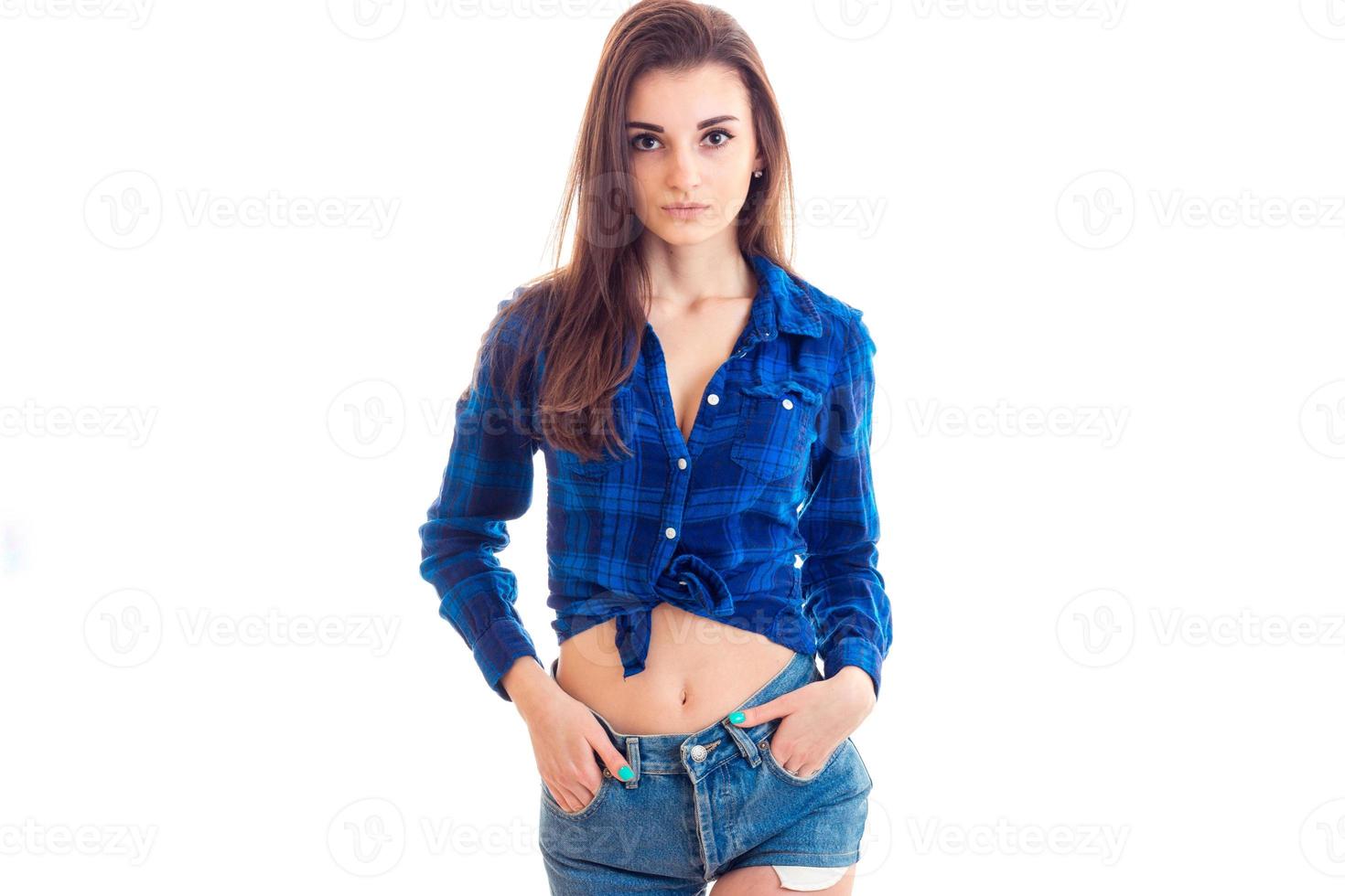 beautiful sweet girl with dark hair and a Plaid Shirt posing and looking at camera photo