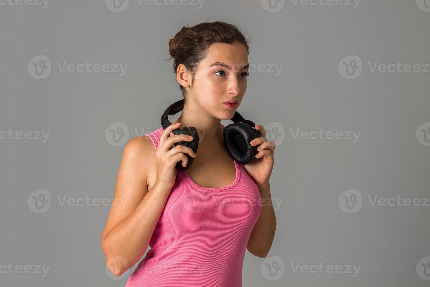 girl with headphones in studio photo