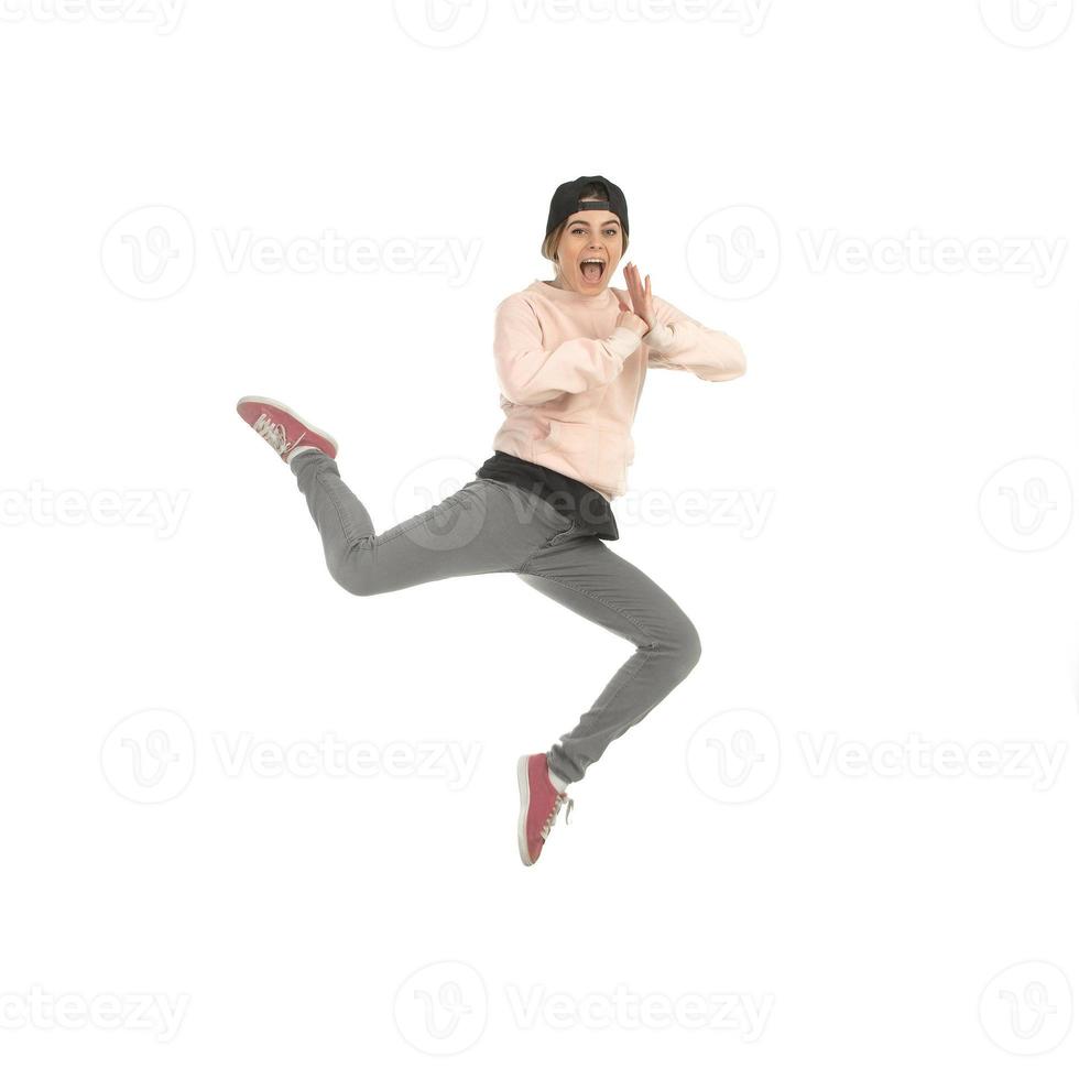 young blonde woman in studio jumping photo