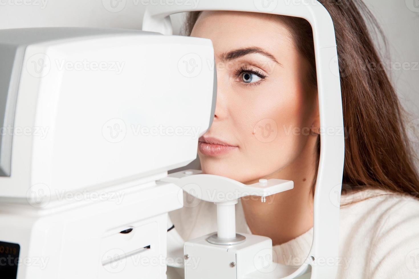 young woman checks the vision photo