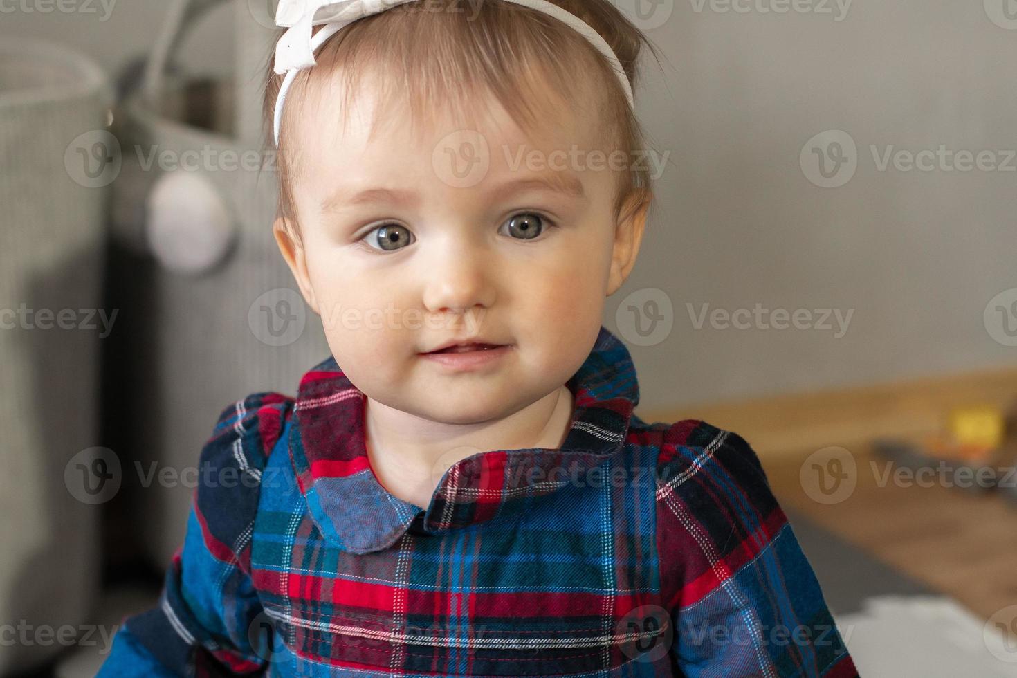 Cutie little baby girl smiles at home photo