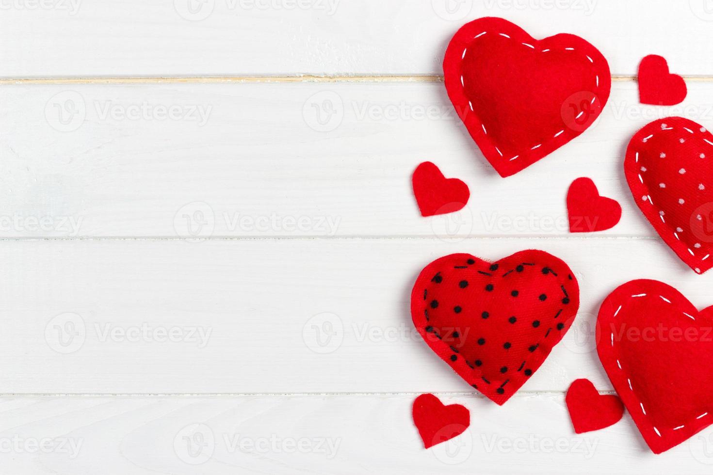 Hearts on white wood background. Valentines day background photo
