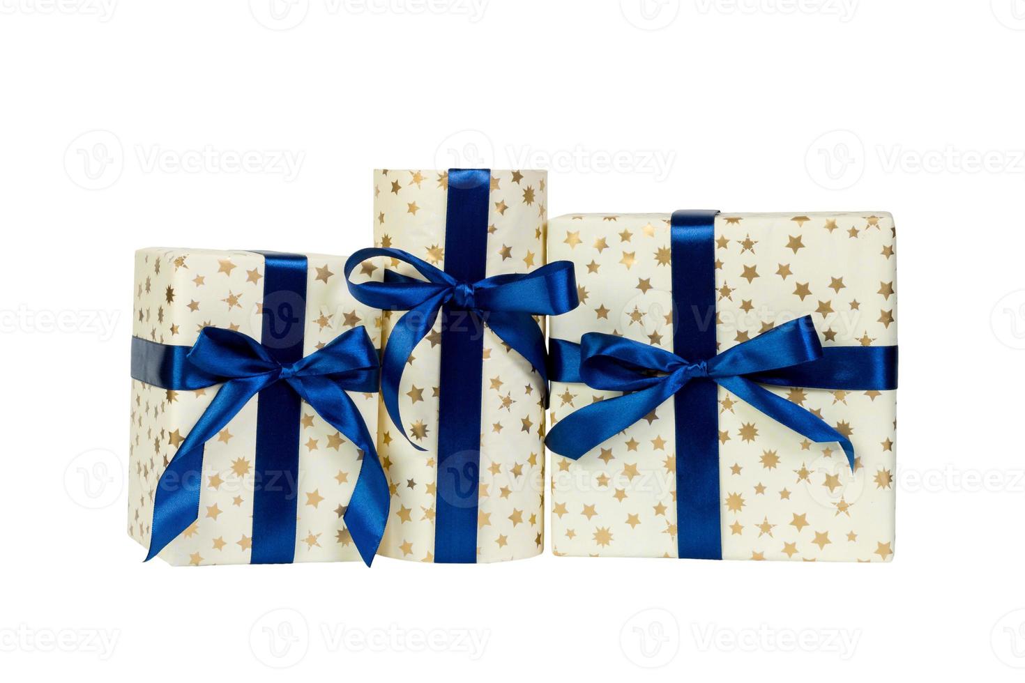 Set of Christmas or other holiday handmade present in gold paper with blue ribbon. Isolated on white background, top view. thanksgiving Gift box concept photo