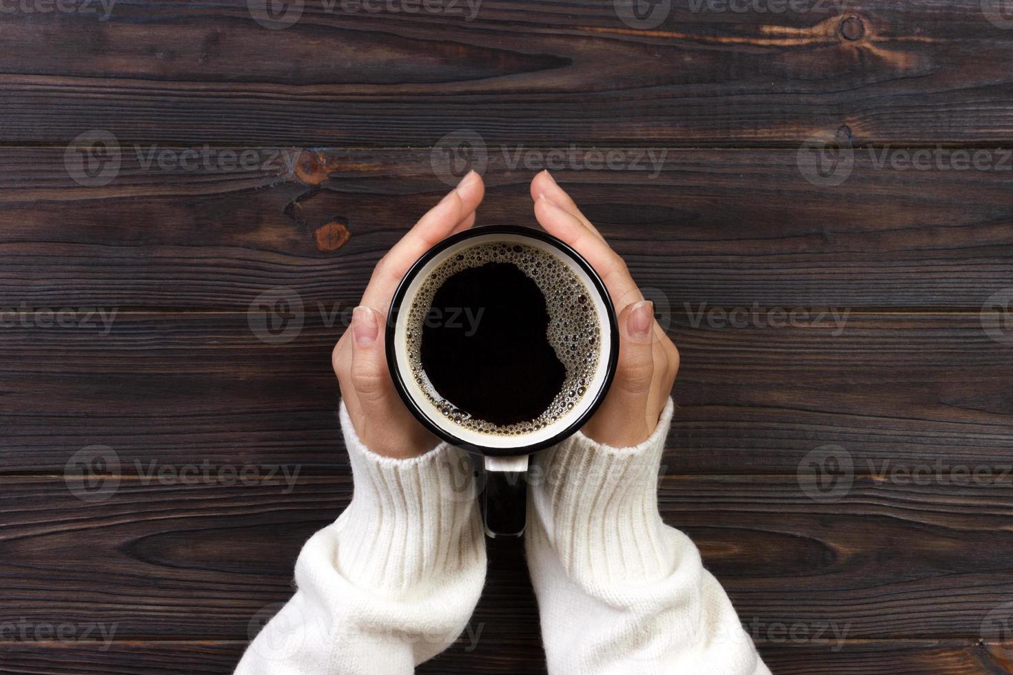 Women hands with coffee. harvesting coffee berries by agriculturist hands photo