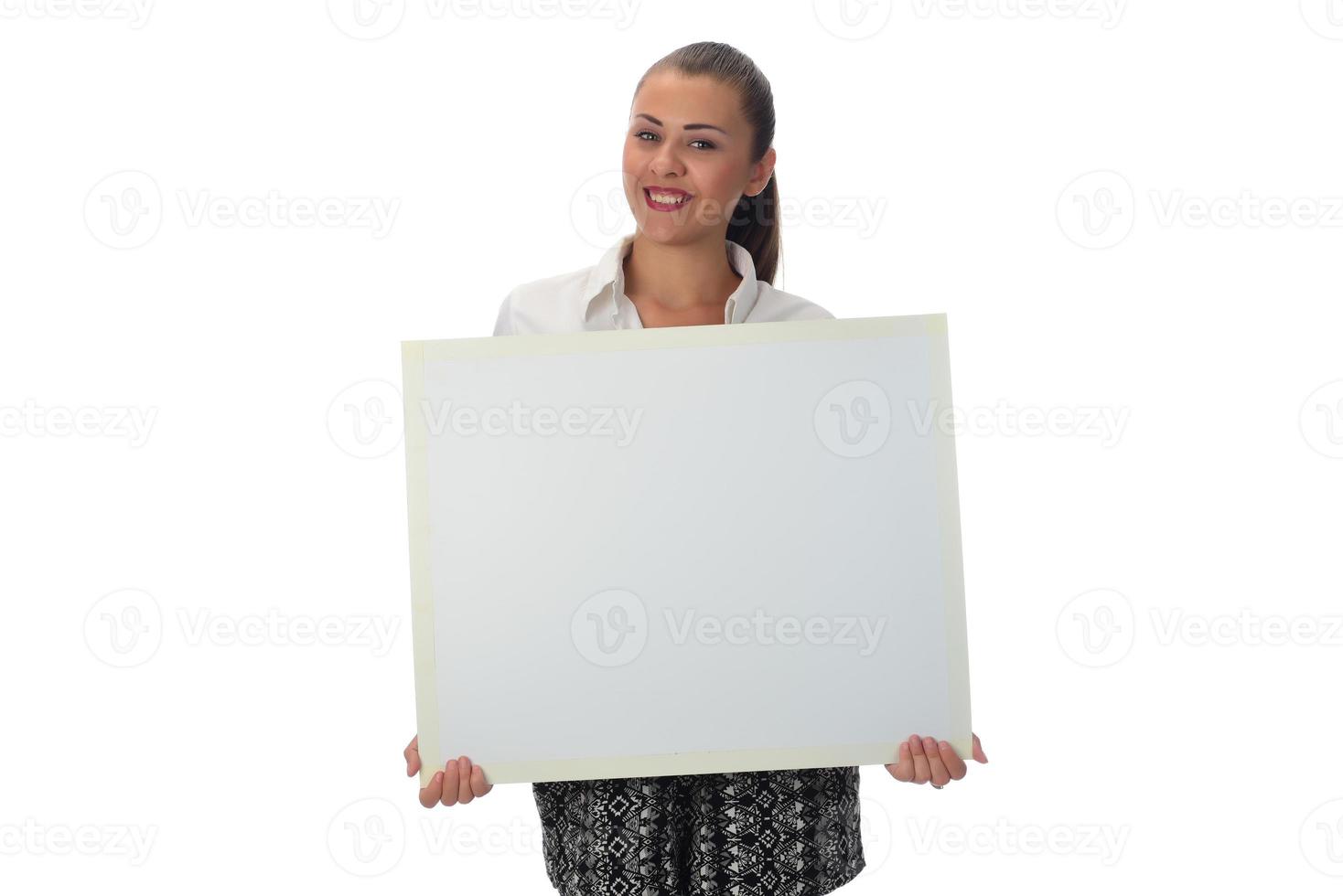 Happy young businesswoman doing business presentation at whiteboard, smiling, isolated on white background. photo