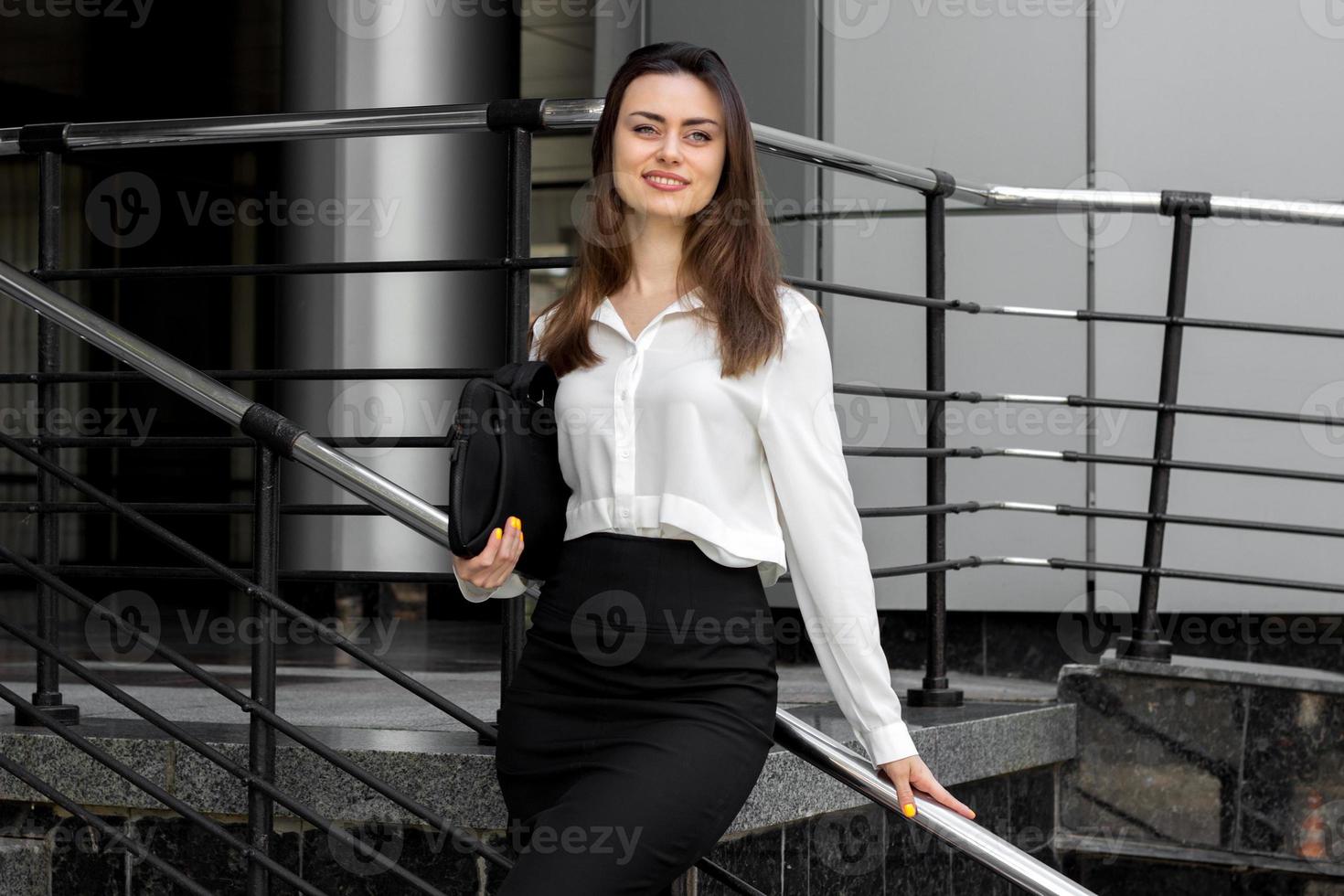 beautiful young business girl in the white shirt photo