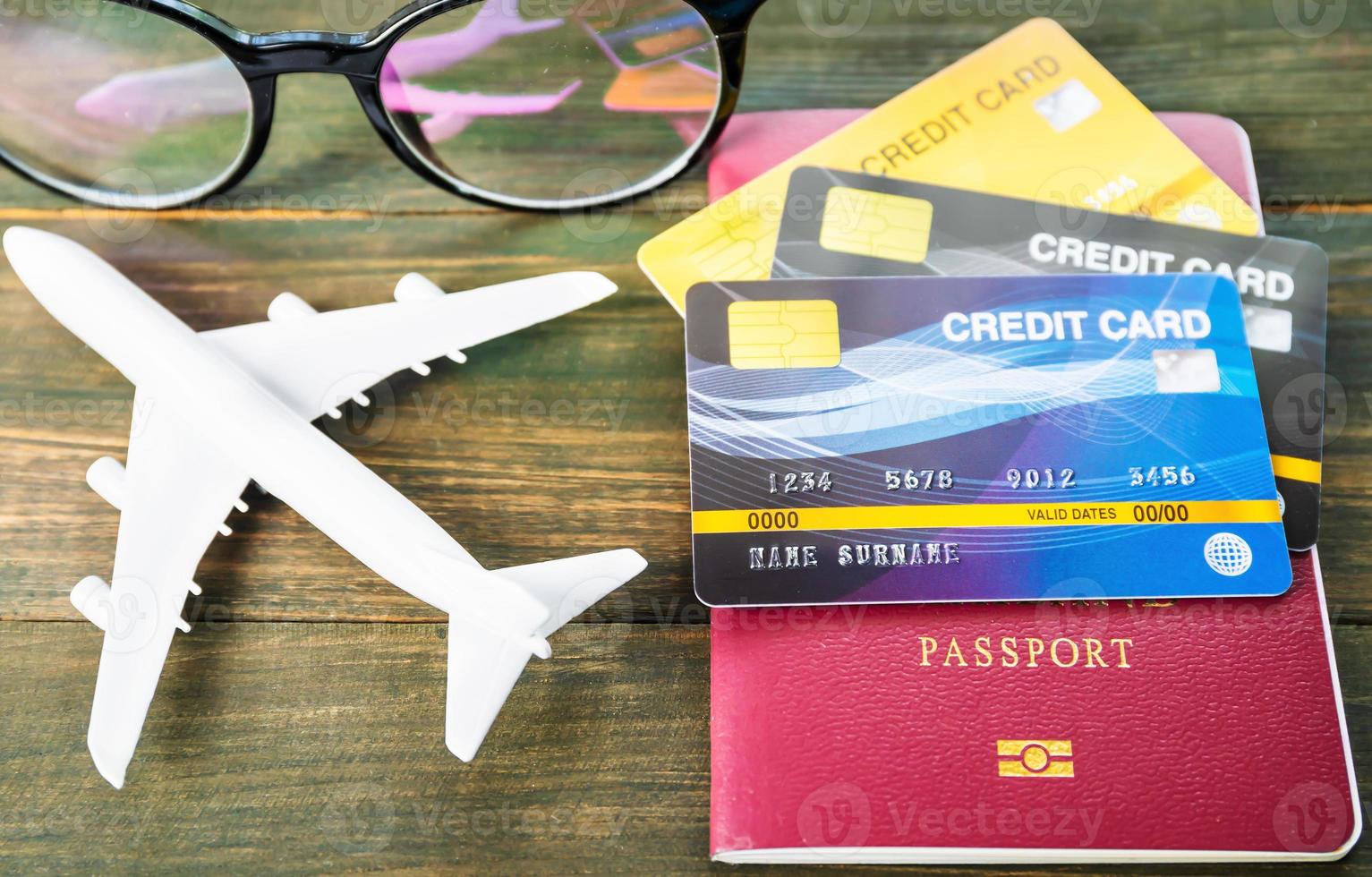 Passport and credit card on wooden desk photo