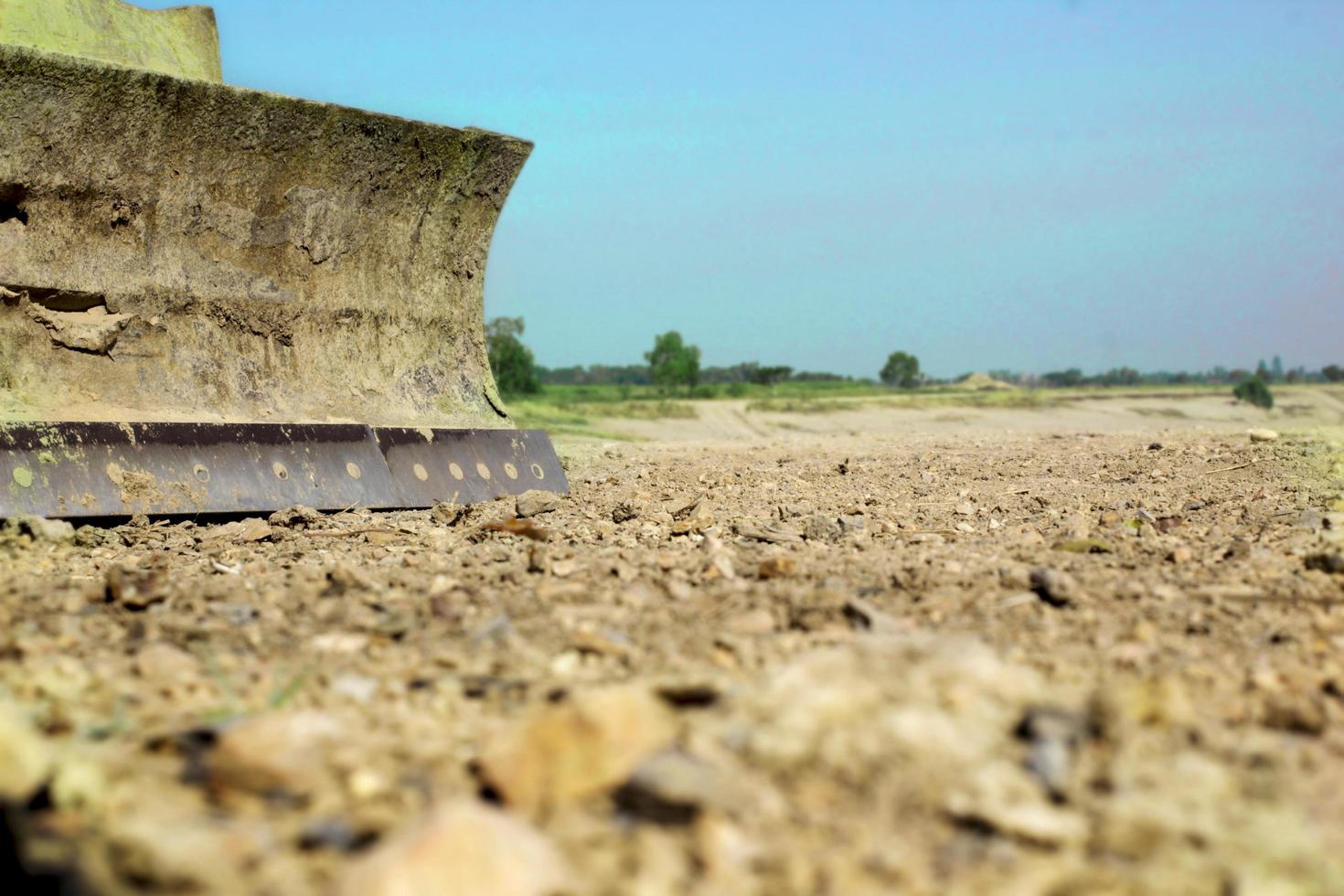 Bulldozer works in the open air outdoors. photo