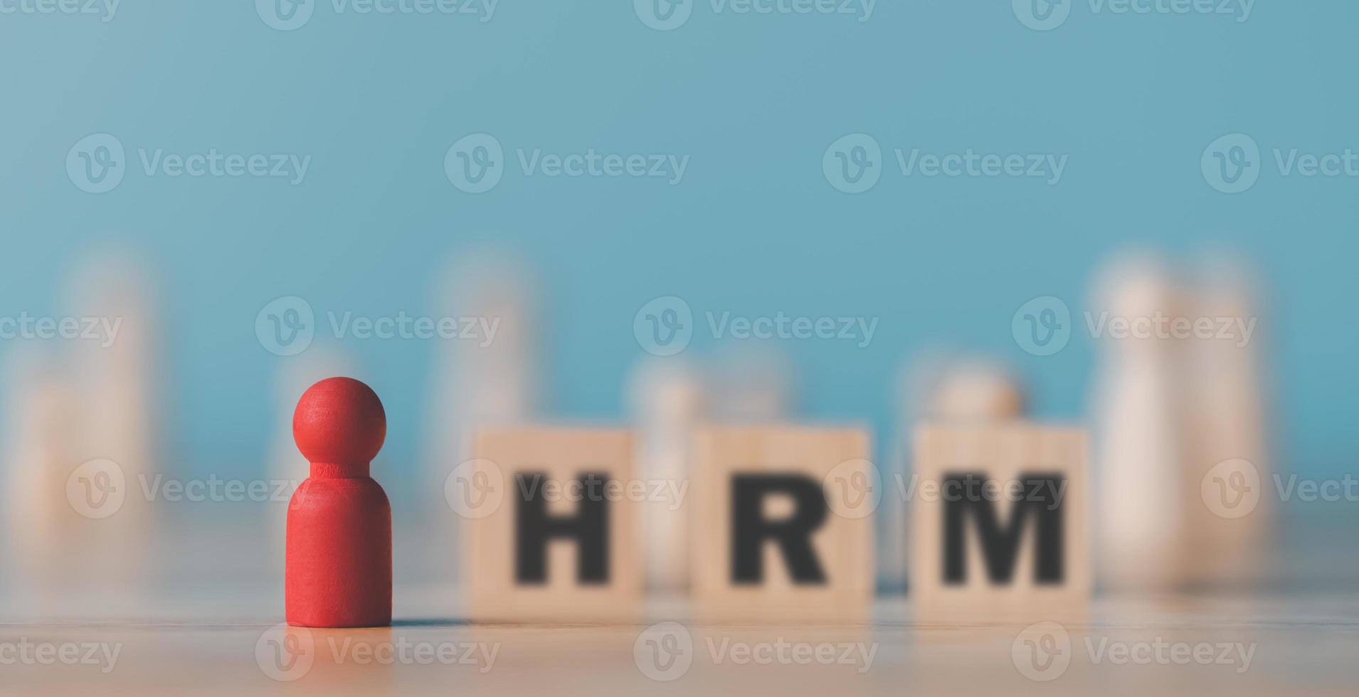 A wooden doll sits on the table,HRM or Human Resource Management,leadership in recruitment,Business development by choosing professional leaders employee competency teamwork,Taregt customer photo