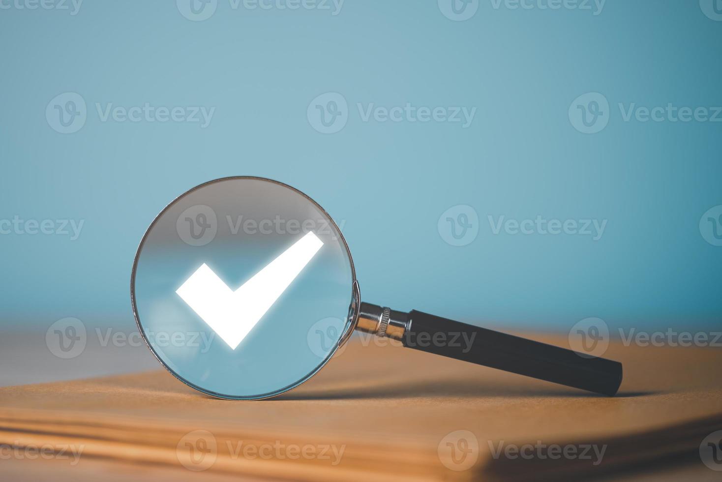 magnifying glass and check mark icon,show check the authenticity of the document,concept of rules of conduct rules and policies company regulations Terms and Conditions photo