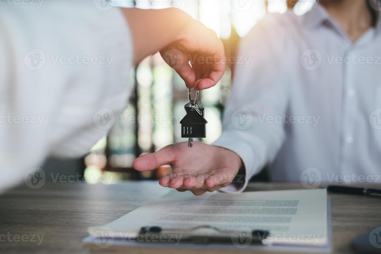 keys in the hand of a real estate agent,Investment loan approval concepts to build residential homes, real estate business, investment savings, mortgages and bank loans, future retirement planning. photo