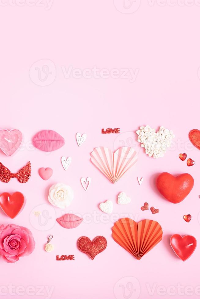 Pattern from different hearts and valentines day symbols elements top view. Creative valentines day flat lay vertical background photo