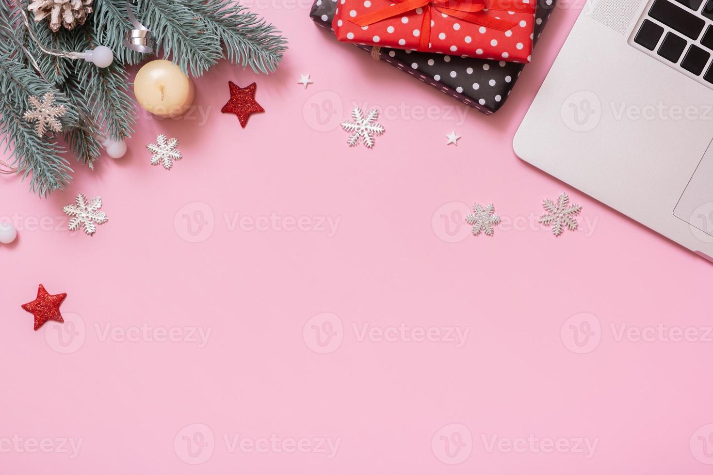 Cristmas New Year decoration on work table with copy space top view, flat lay on pink background. Business xmas concept photo