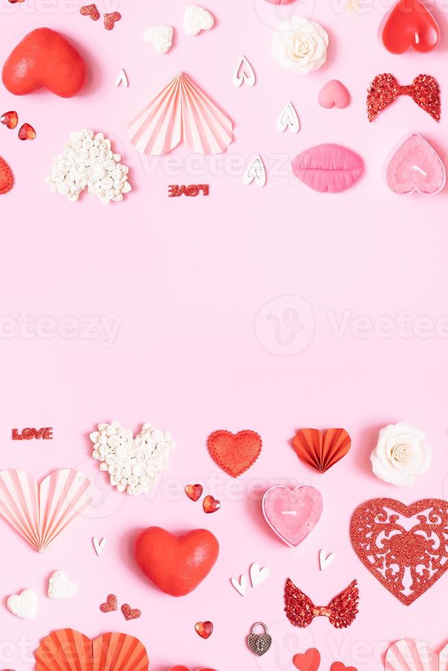 Pattern from different hearts and valentines day symbols elements top view. Creative valentines day flat lay vertical background photo
