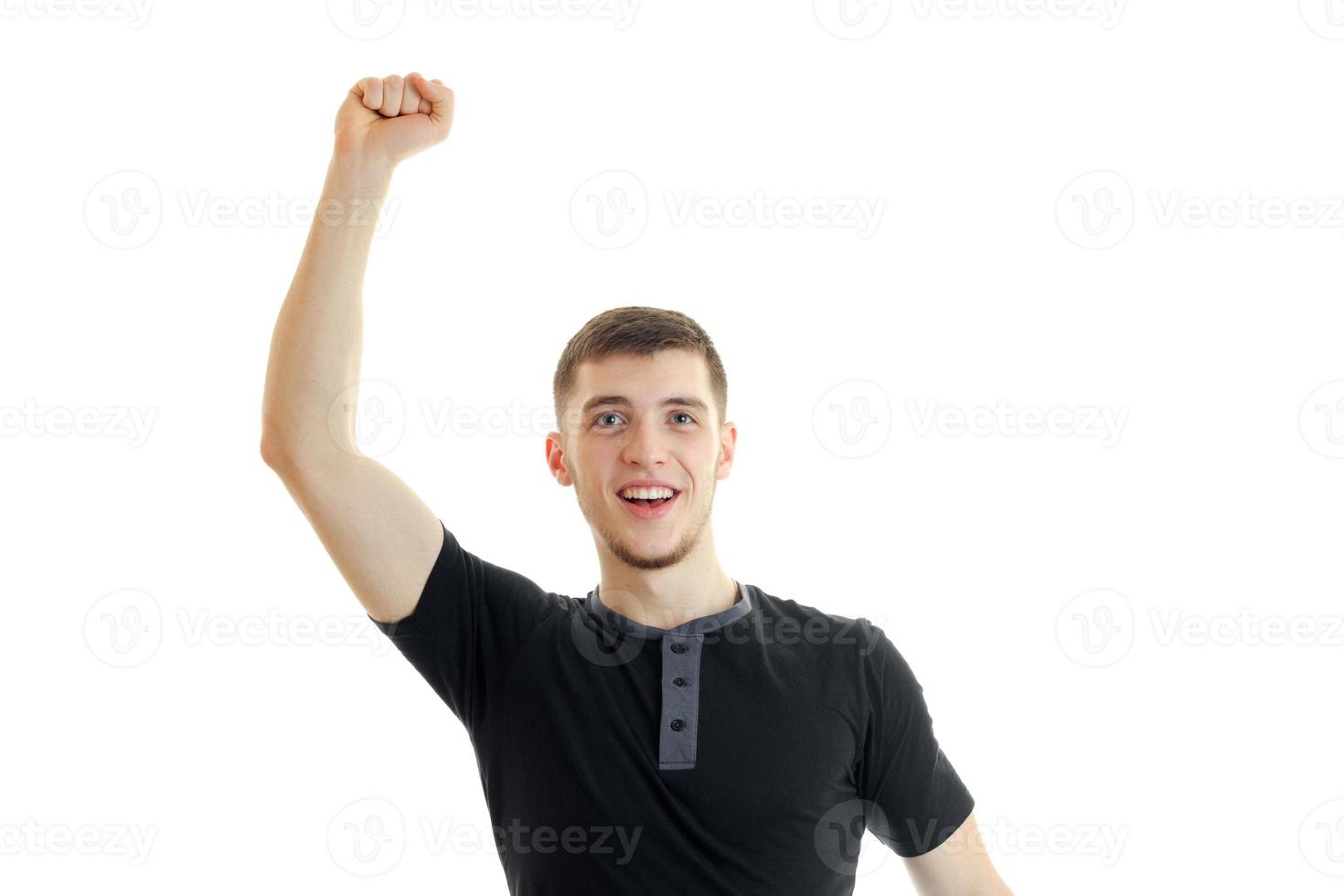 handsome gay guy raises his hand up and yells open-mouthed photo