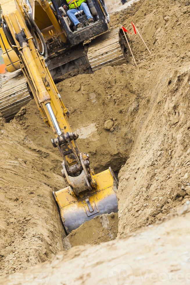 Excavator Tractor Digging A Trench photo