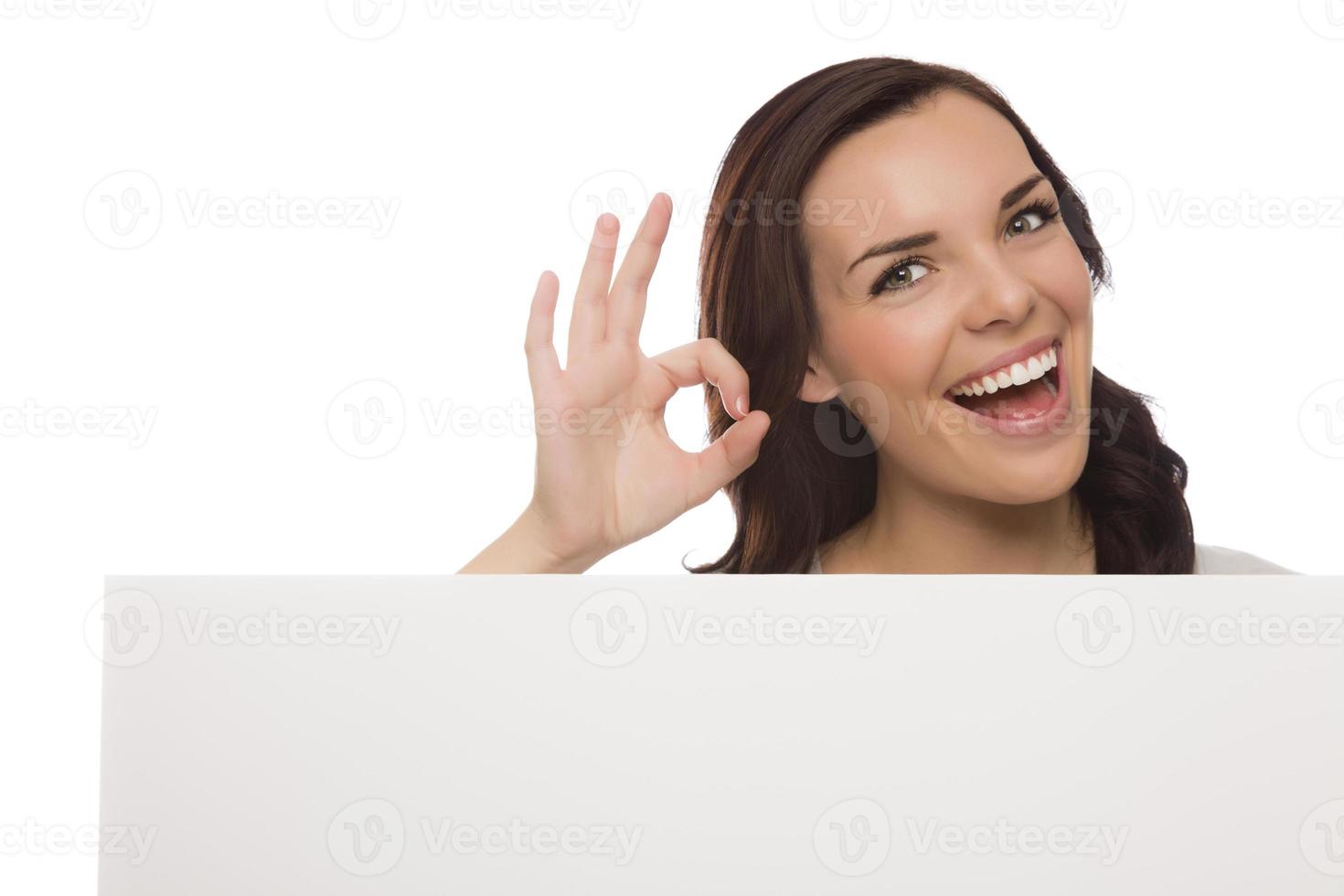 Smiling Mixed Race Female Holding Blank Sign on White photo