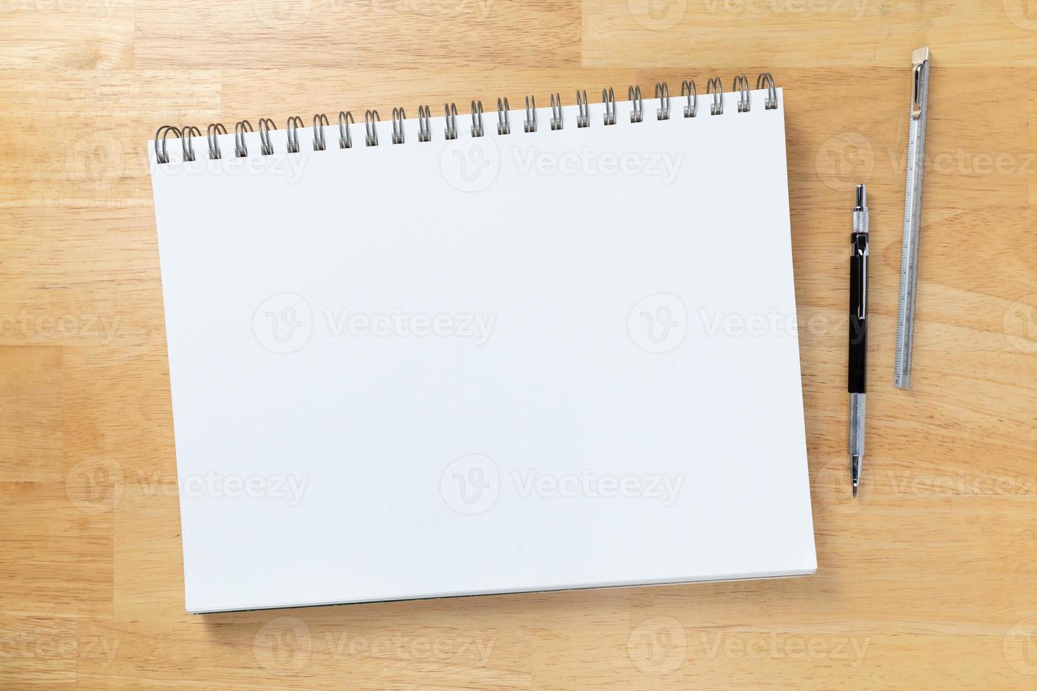 Blank Sketch Paper Tablet Binder Resting on Desk Top with Engineering Pencil and Ruler photo