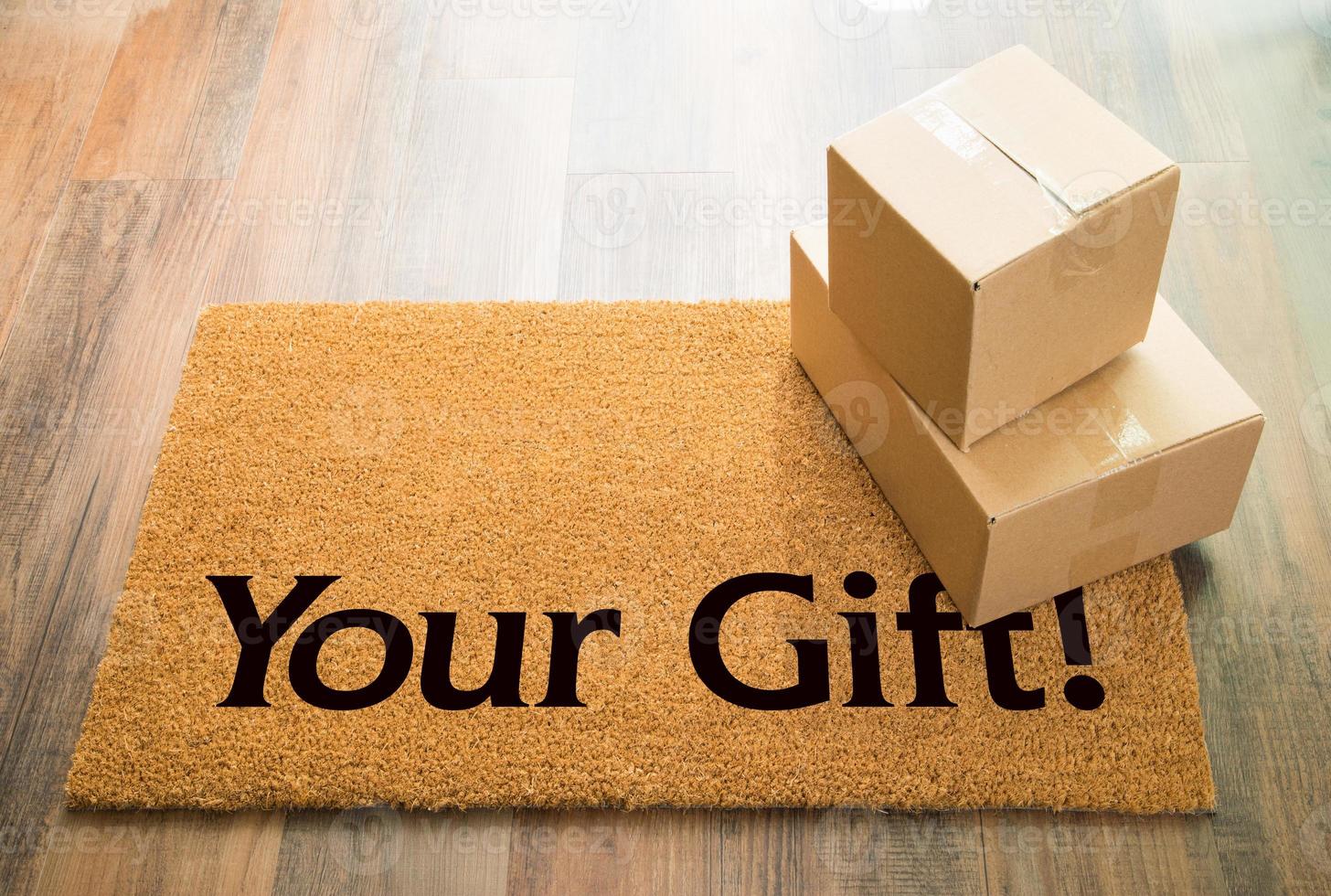 Your Gift Welcome Mat On Wood Floor With Shipment of Boxes photo